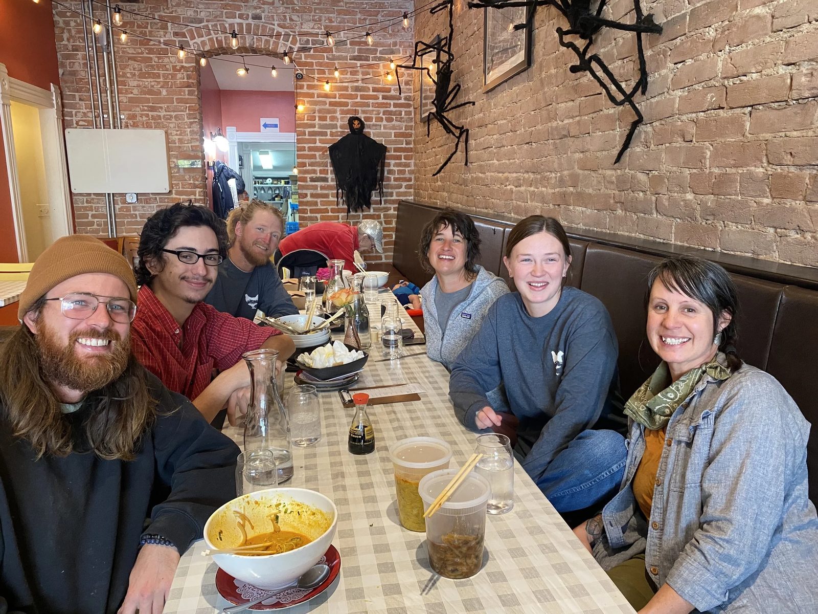 The crew around a long table at a meal
